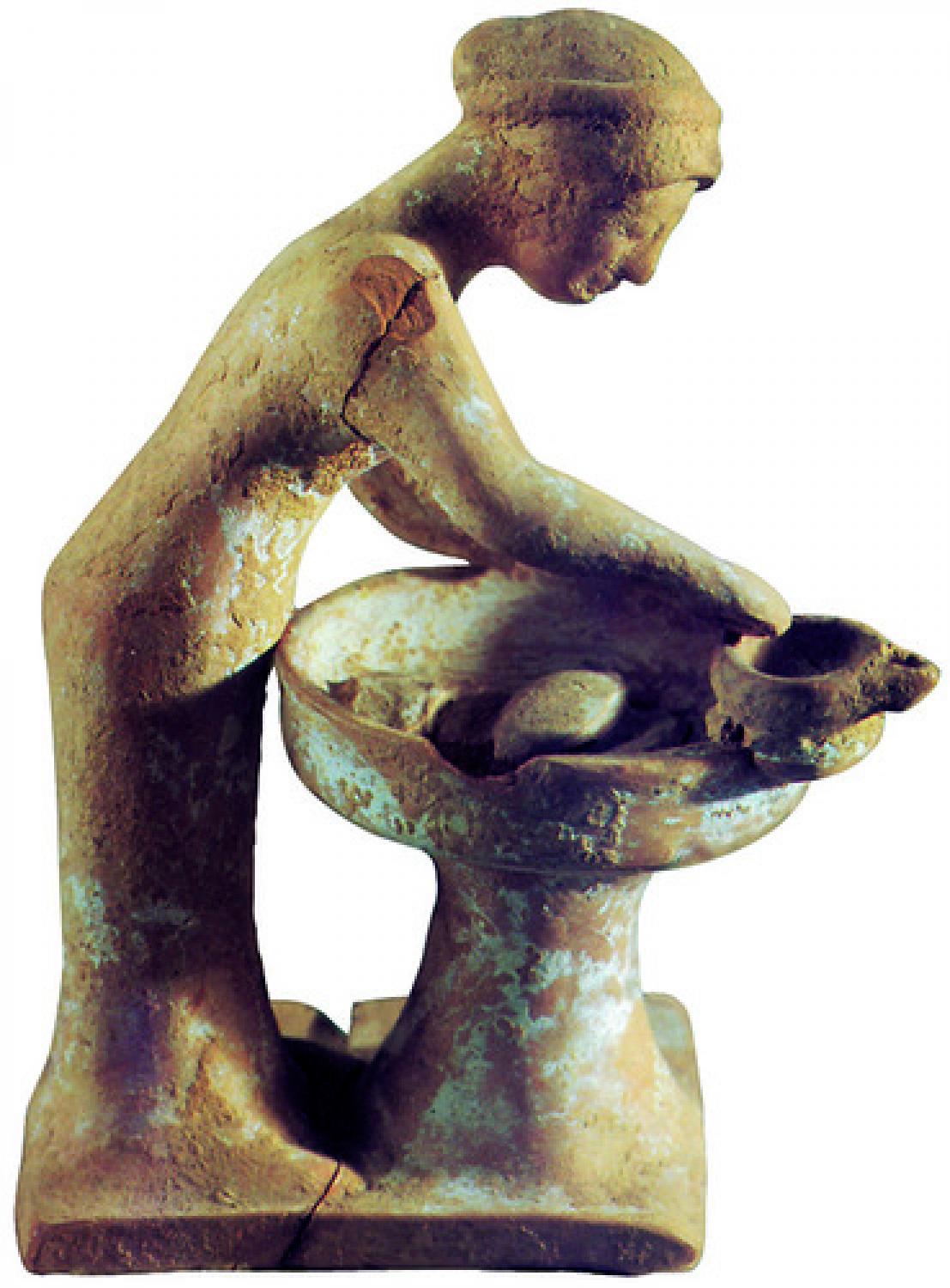 Donna che impasta il pane, statuetta micenea.